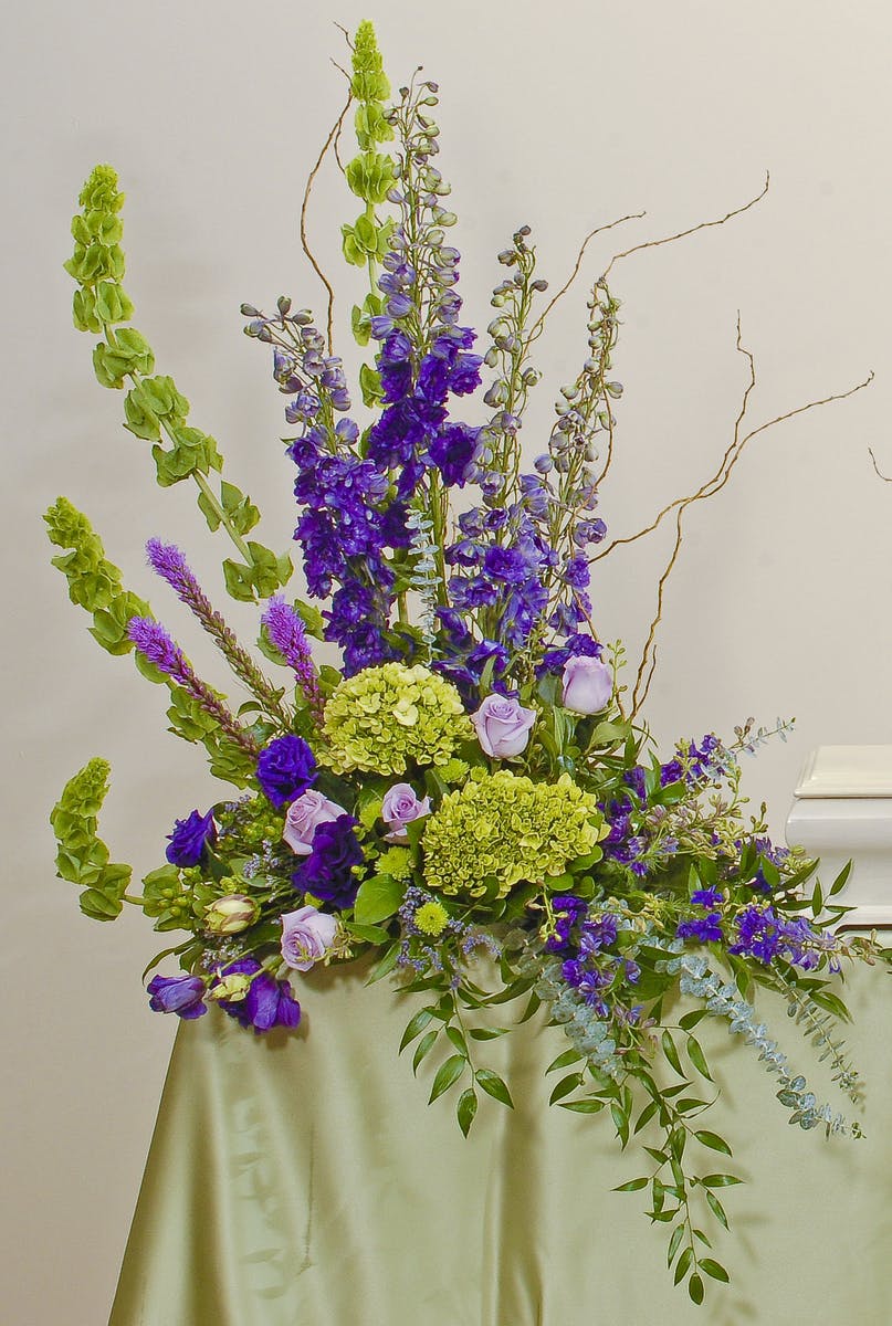 Bold Spring cremation sidepiece sympathy arrangement delivered in Baton