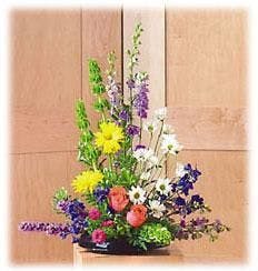 Sympathy Arrangement of Daisies Roses and Liatris delivered in Baton